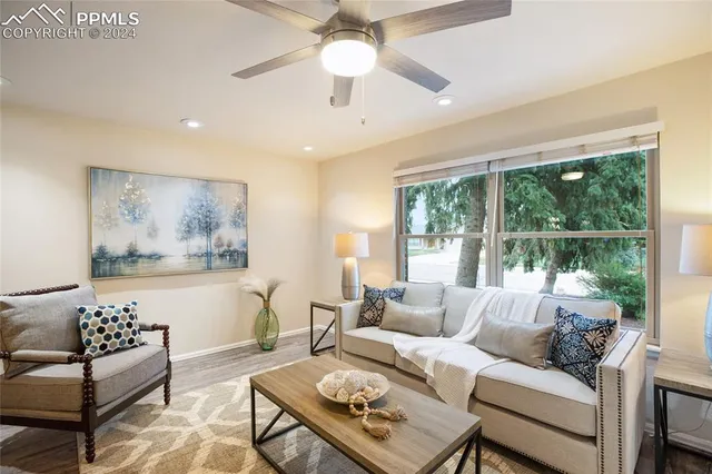 a living room with furniture and a large window