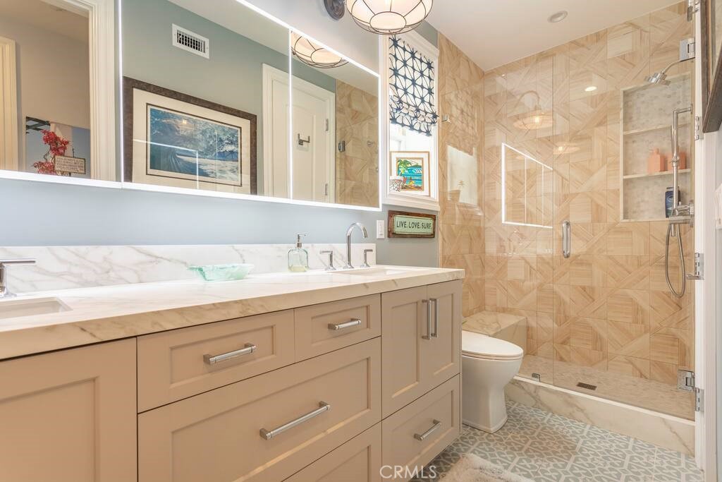 314 32nd Street Manhattan Beach, CA 90266 - Photo 21 of 27 a bathroom with a granite countertop sink a toilet and a shower