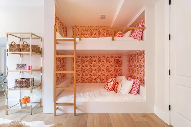 a living room with a couch and wooden floor