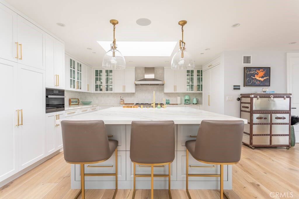 314 32nd Street Manhattan Beach, CA 90266 - Photo 7 of 27 a living room with kitchen island furniture and wooden floor