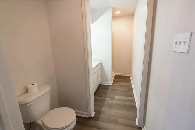 a bathroom with a toilet and a shower