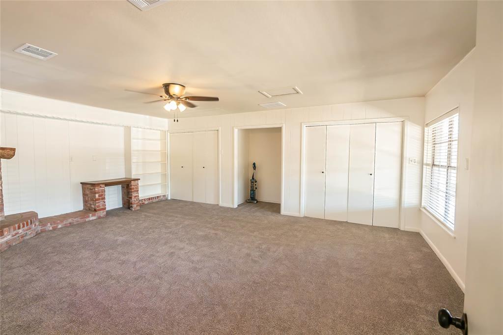 1226 Clay Street Nocona, TX 76255 - Photo 24 of 31 a view of a livingroom with a ceiling fan and window