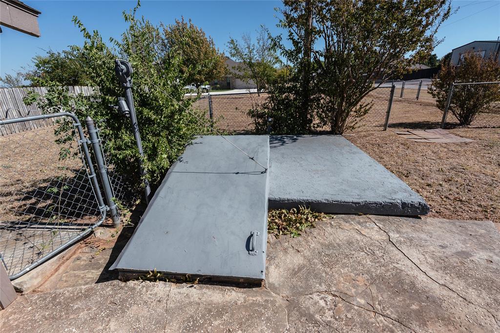 1226 Clay Street Nocona, TX 76255 - Photo 30 of 31 a view of a backyard with a sink