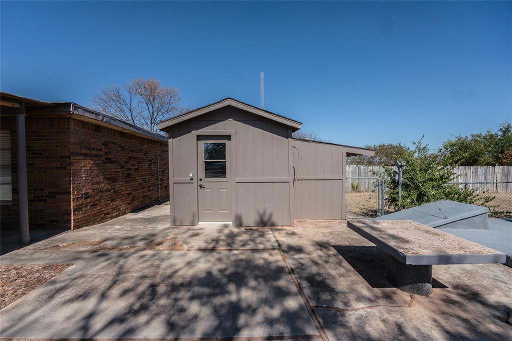 1226 Clay Street Nocona, TX 76255 - Photo 31 of 31 a backyard of a house