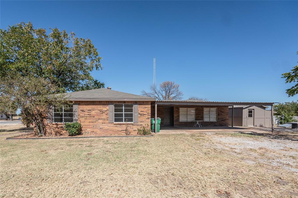1226 Clay Street Nocona, TX 76255 - Photo 8 of 31 front view of a house with a yard