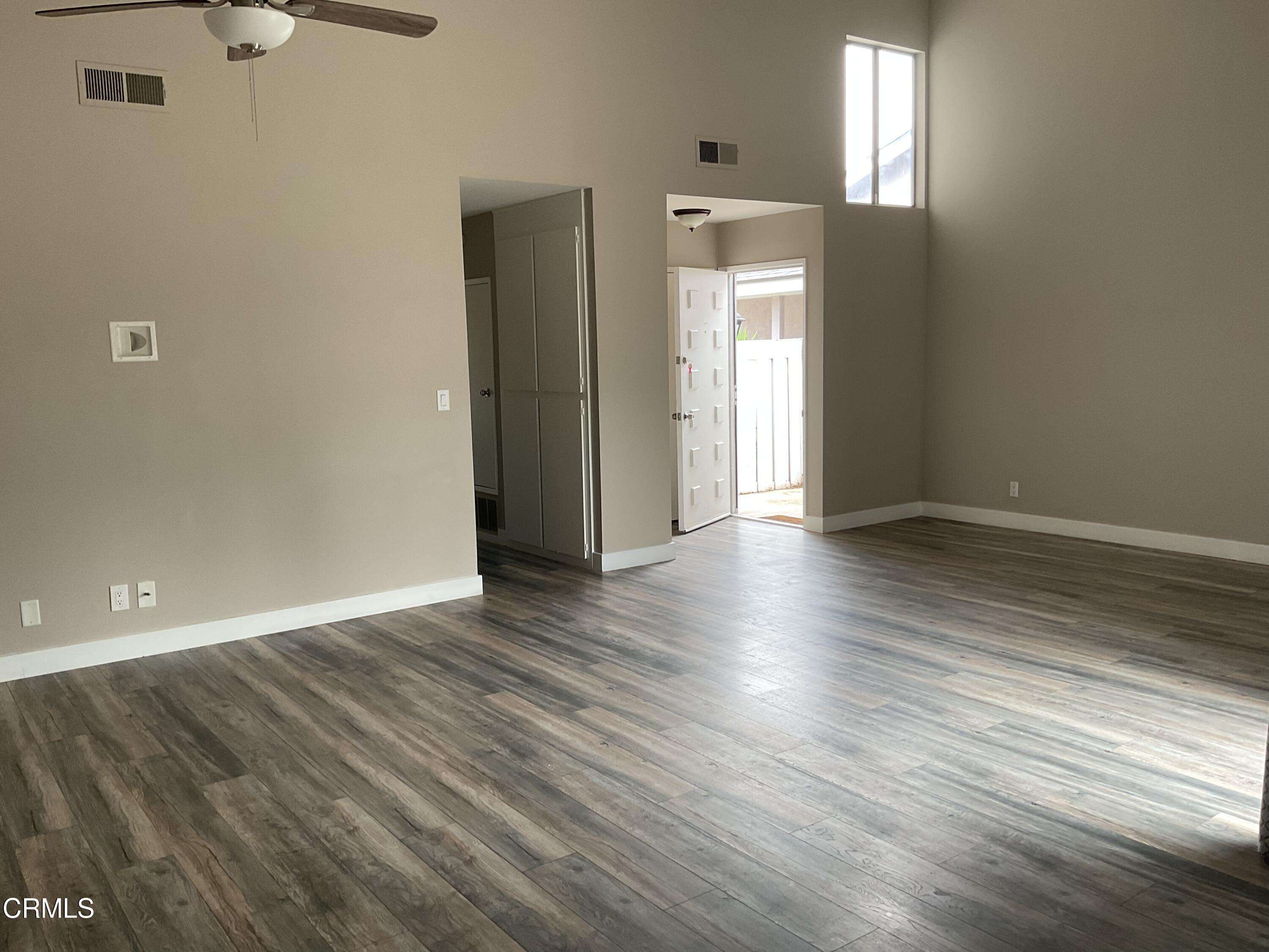 2022 Norma Street Oxnard, CA 93036 - Photo 12 of 13 an empty room with wooden floor and windows