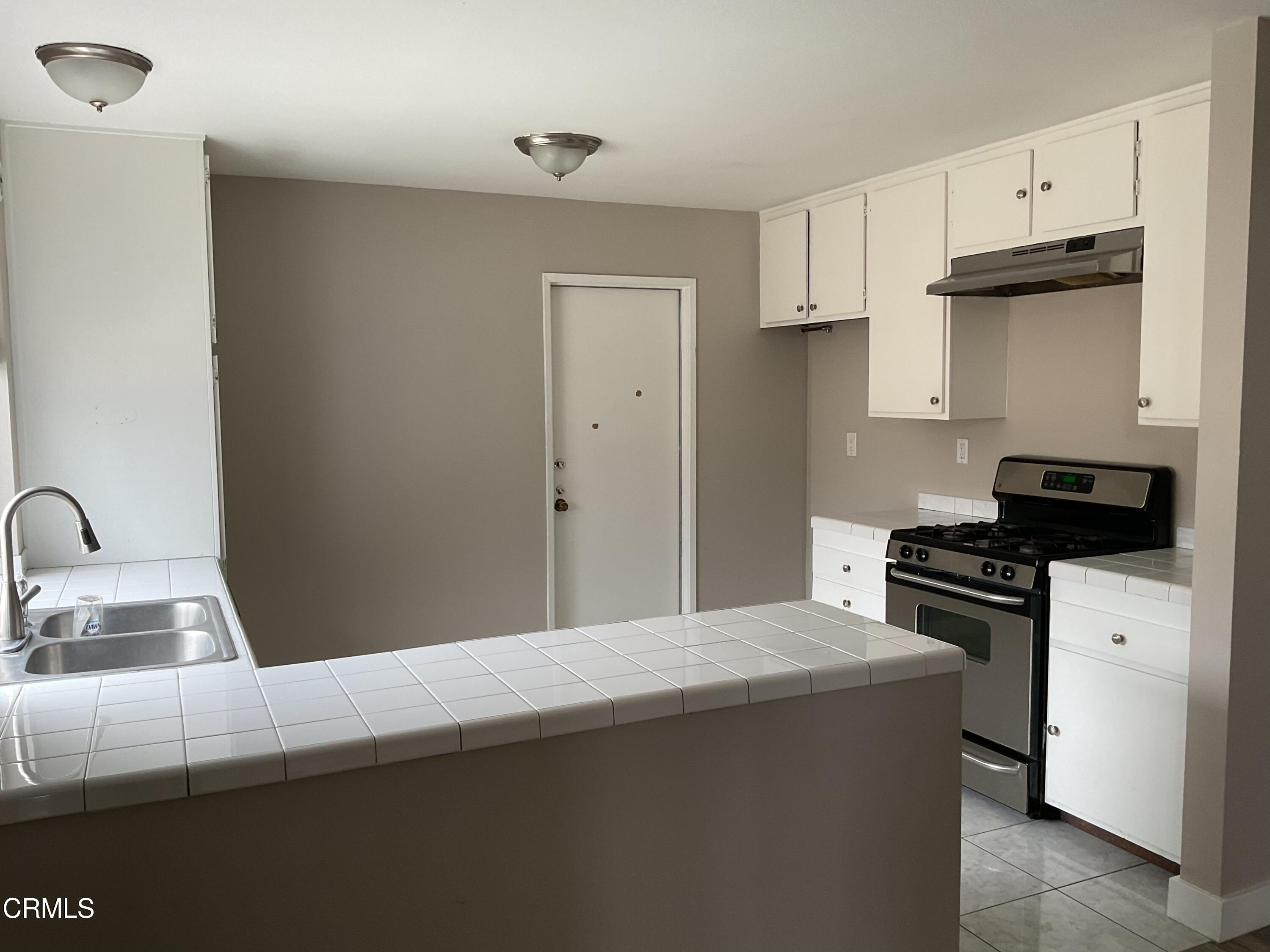2022 Norma Street Oxnard, CA 93036 - Photo 8 of 13 a kitchen with a stove and a sink