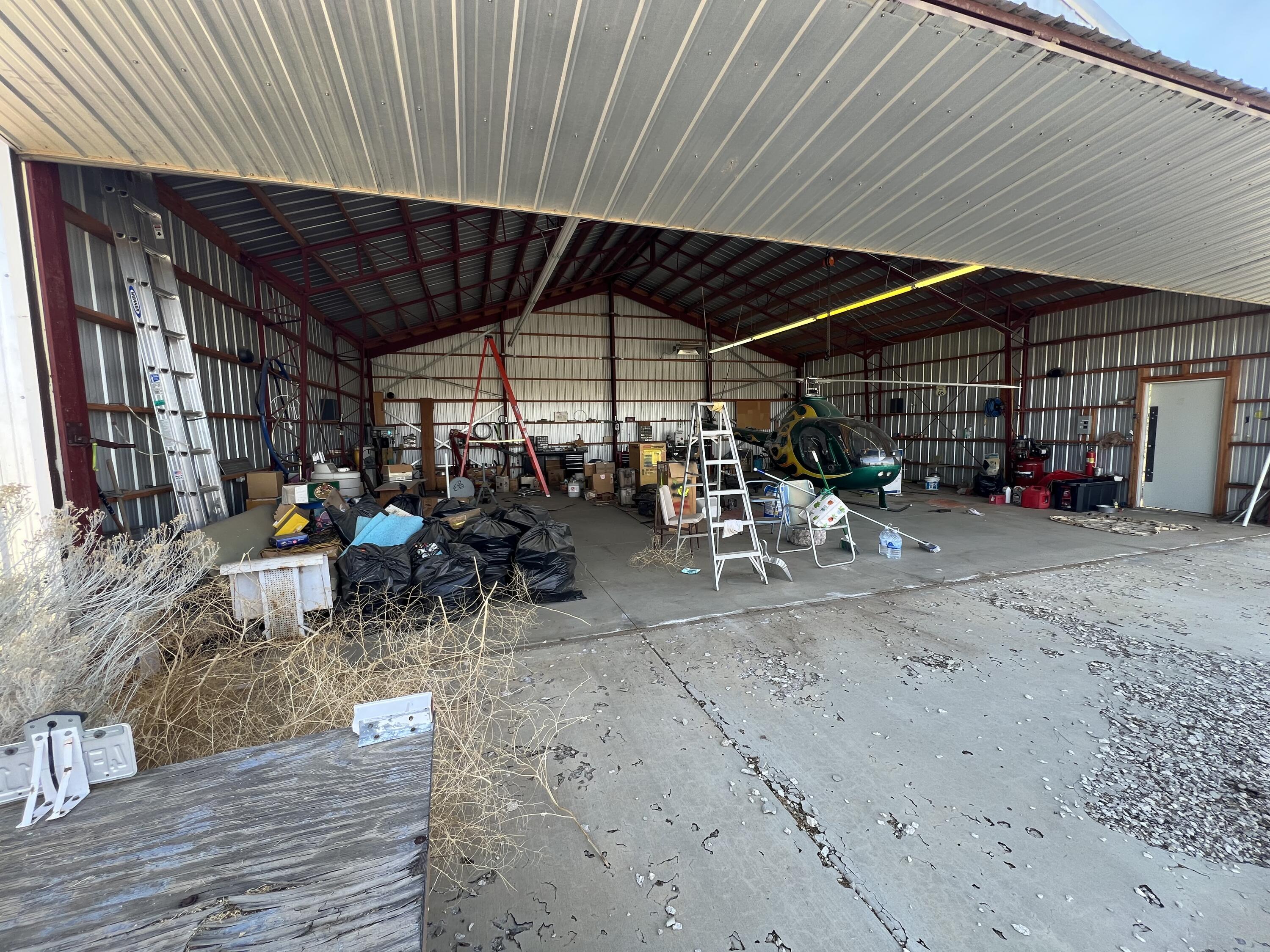 17120 Bob's Gap Road Valyermo, CA 93563 - Photo 13 of 26 a view of a patio with table and chairs under an umbrella