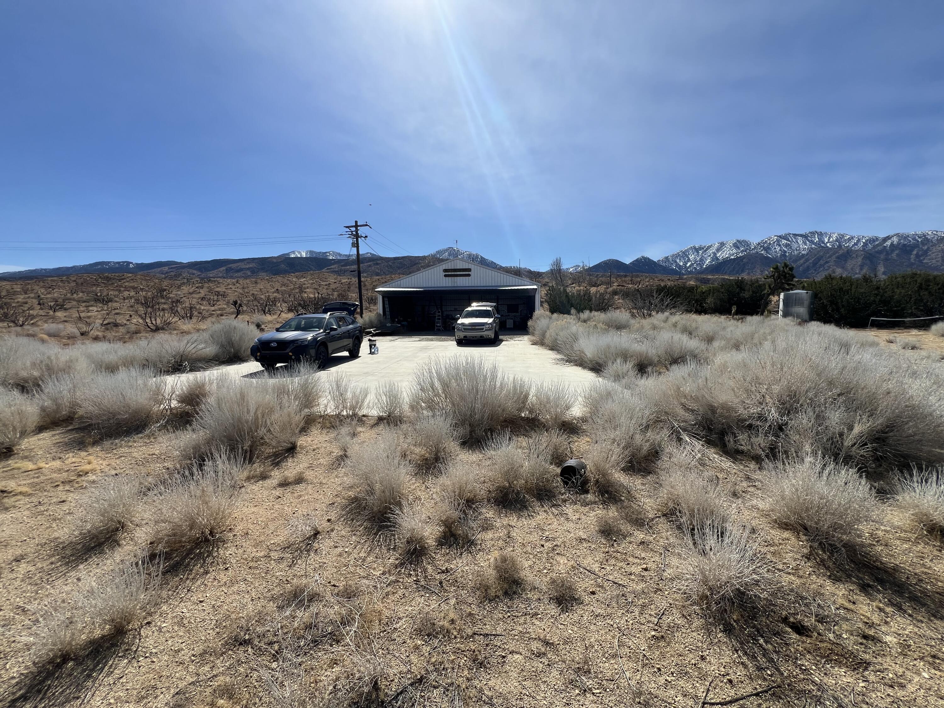 17120 Bob's Gap Road Valyermo, CA 93563 - Photo 17 of 26 a view of a dry yard with lots of trees