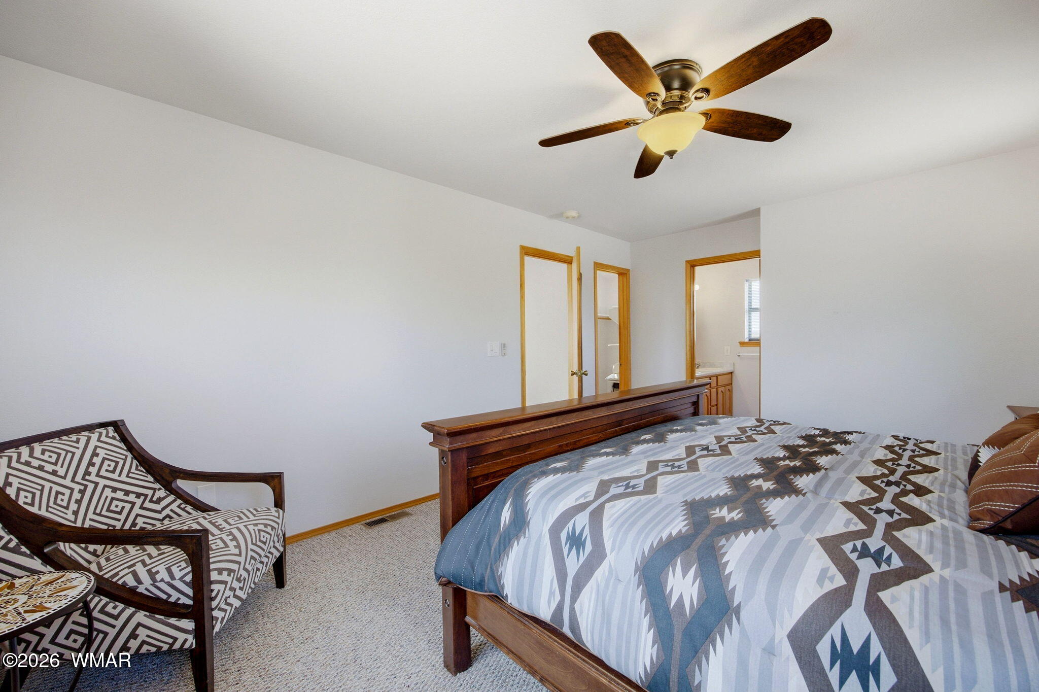 2806 Sky Hawk Drive Overgaard, AZ 85933 - Photo 25 of 43 a bed sitting in a bedroom next to a window