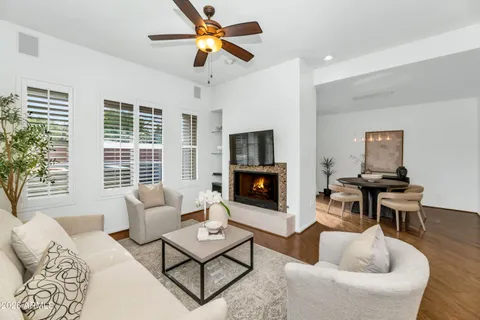 a view of a balcony with chairs and wooden floor