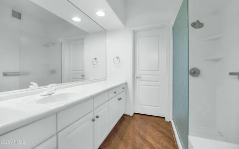 a view of entryway and hall with a chandelier