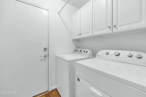 a living room with furniture and a painting