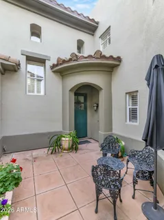 a kitchen with granite countertop white cabinets and stainless steel appliances