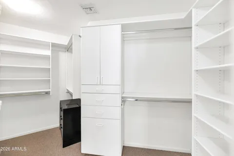 a spacious bathroom with a bathtub and shower