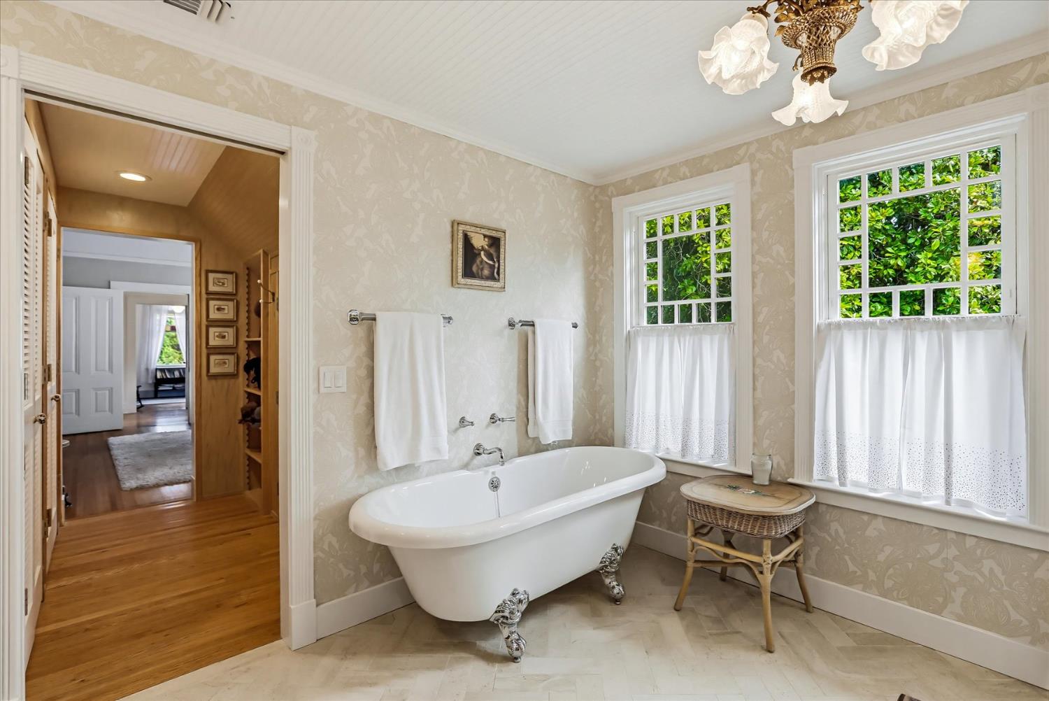 203 Prospect Street Nevada City, CA 95959 - Photo 35 of 99 a spacious bedroom with a bed and a chandelier