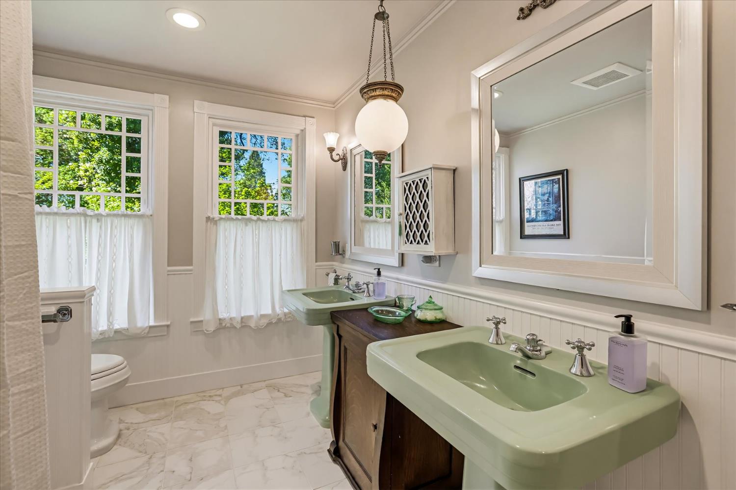 203 Prospect Street Nevada City, CA 95959 - Photo 54 of 99 a bathroom with a tub sink and mirror