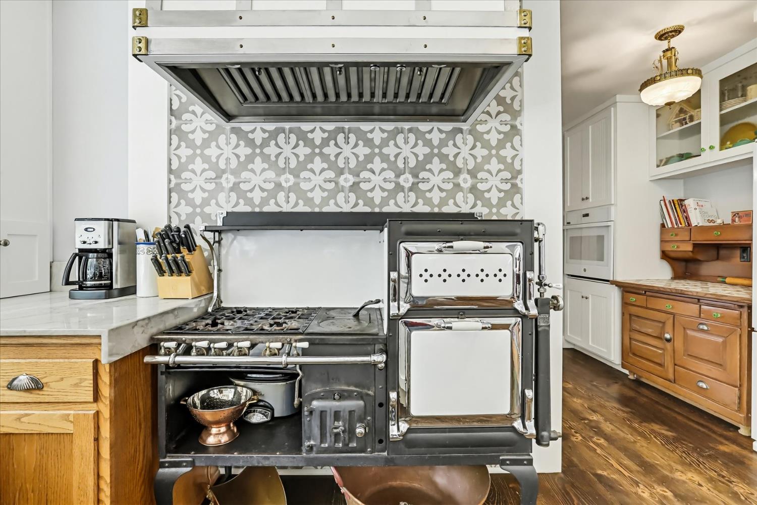 203 Prospect Street Nevada City, CA 95959 - Photo 6 of 99 a kitchen with stainless steel appliances granite countertop a stove and a wooden cabinets