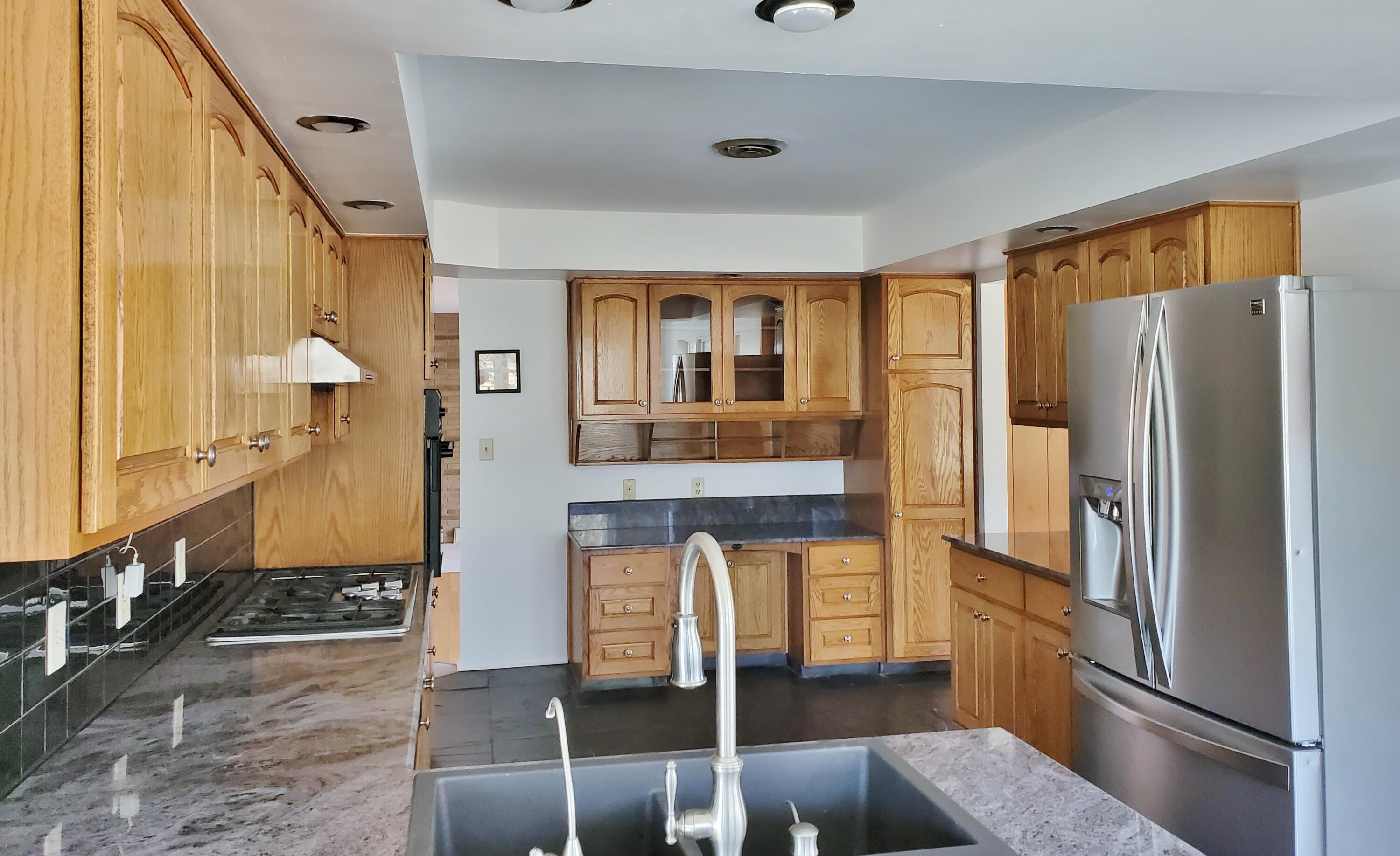1441 North Wozniak Road La Porte, IN 46350 - Photo 11 of 46 a kitchen with stainless steel appliances granite countertop a refrigerator and a stove