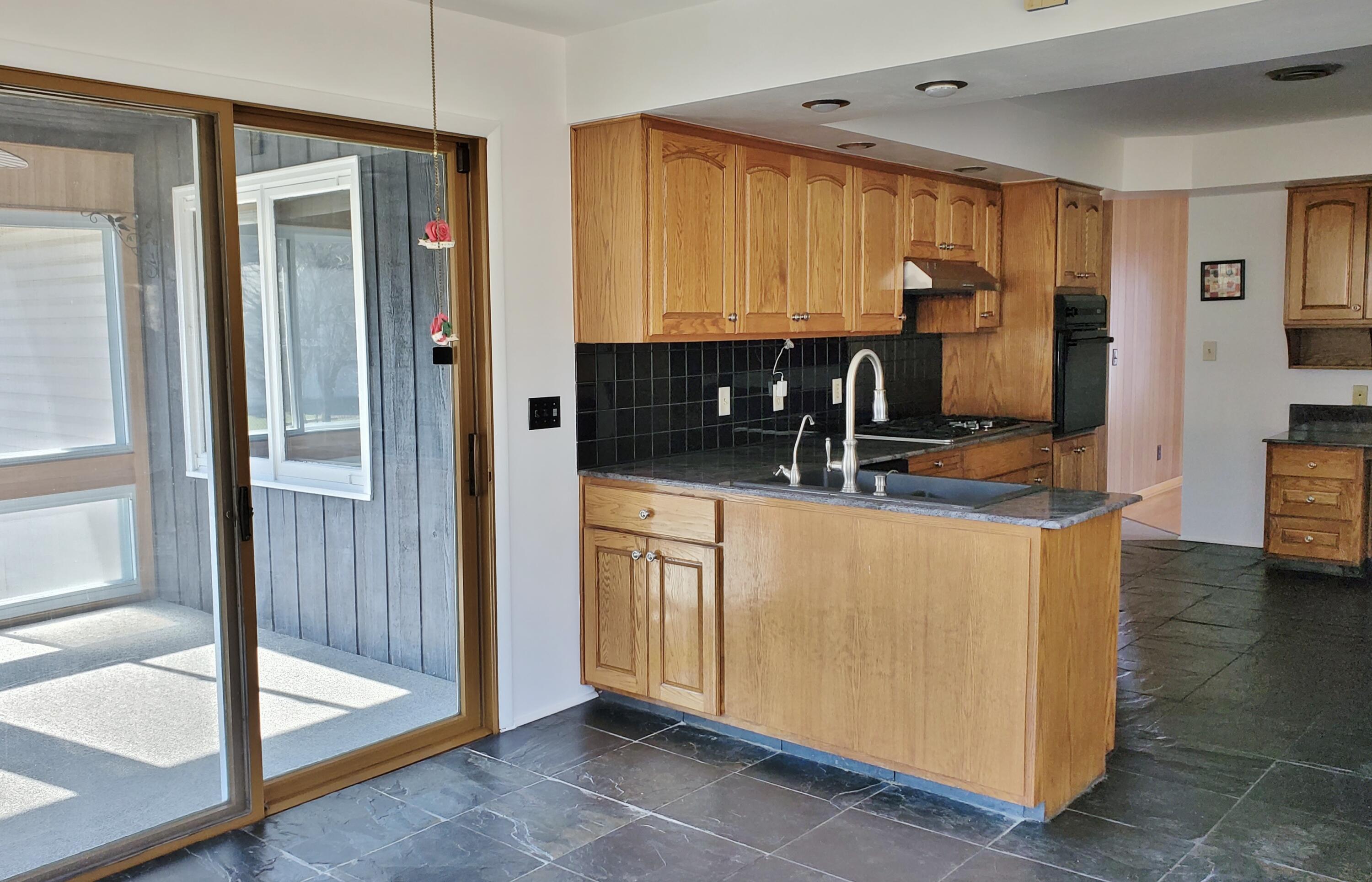 1441 North Wozniak Road La Porte, IN 46350 - Photo 15 of 46 a kitchen with stainless steel appliances granite countertop a refrigerator and a stove