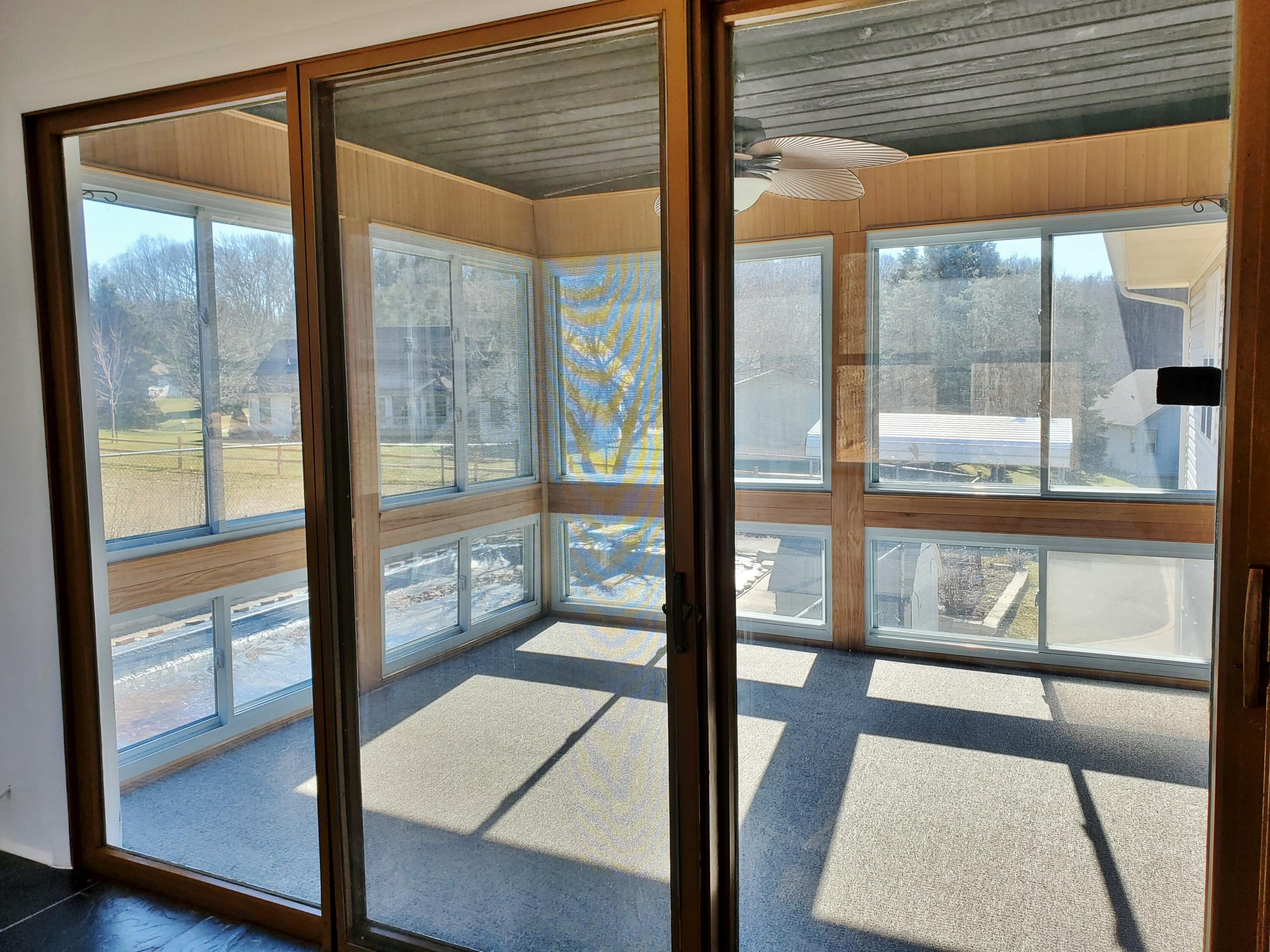 1441 North Wozniak Road La Porte, IN 46350 - Photo 16 of 46 a view of an empty room with wooden floor and windows