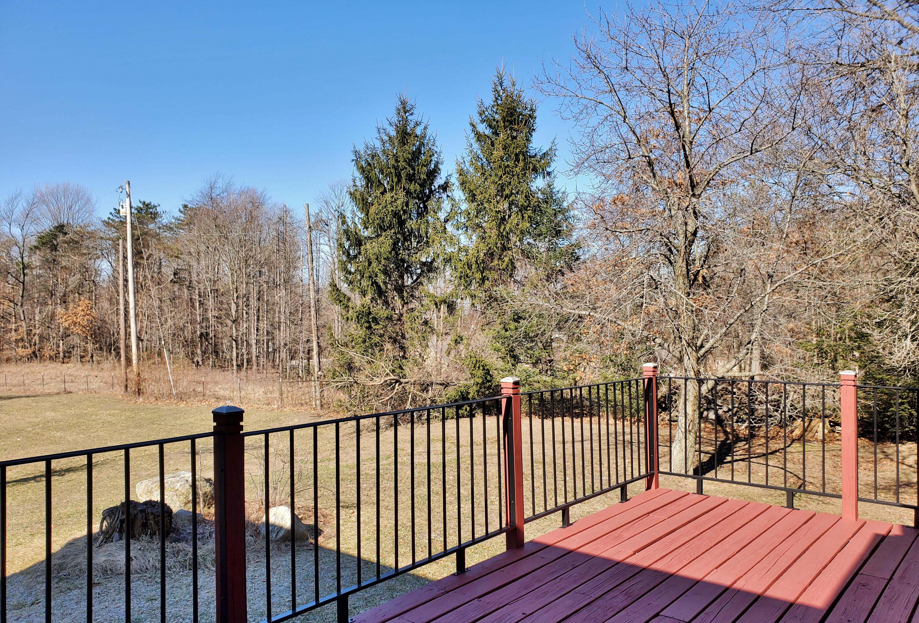 1441 North Wozniak Road La Porte, IN 46350 - Photo 20 of 46 a balcony with wooden floor and fence