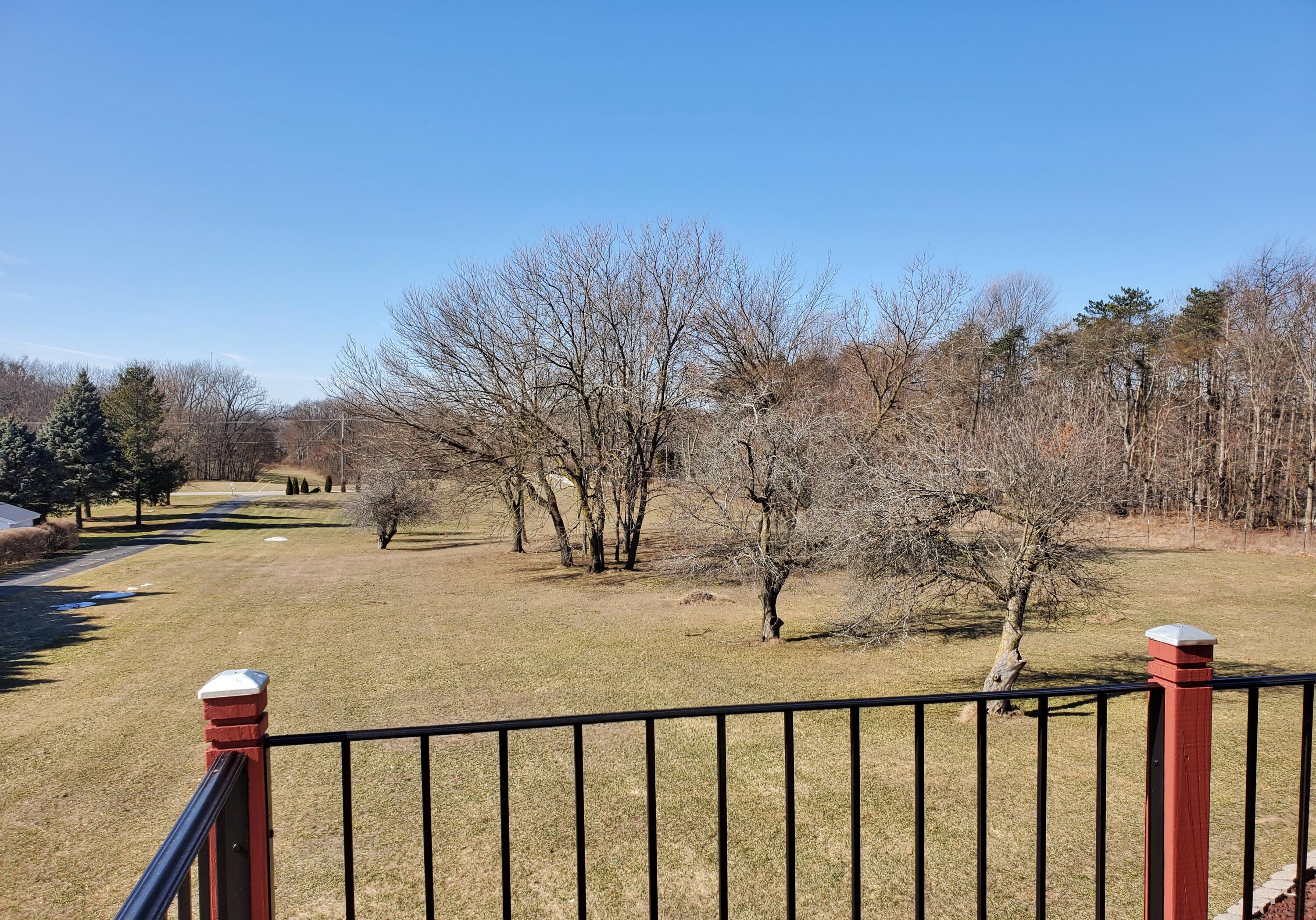 1441 North Wozniak Road La Porte, IN 46350 - Photo 22 of 46 a view of a wooden fence and trees