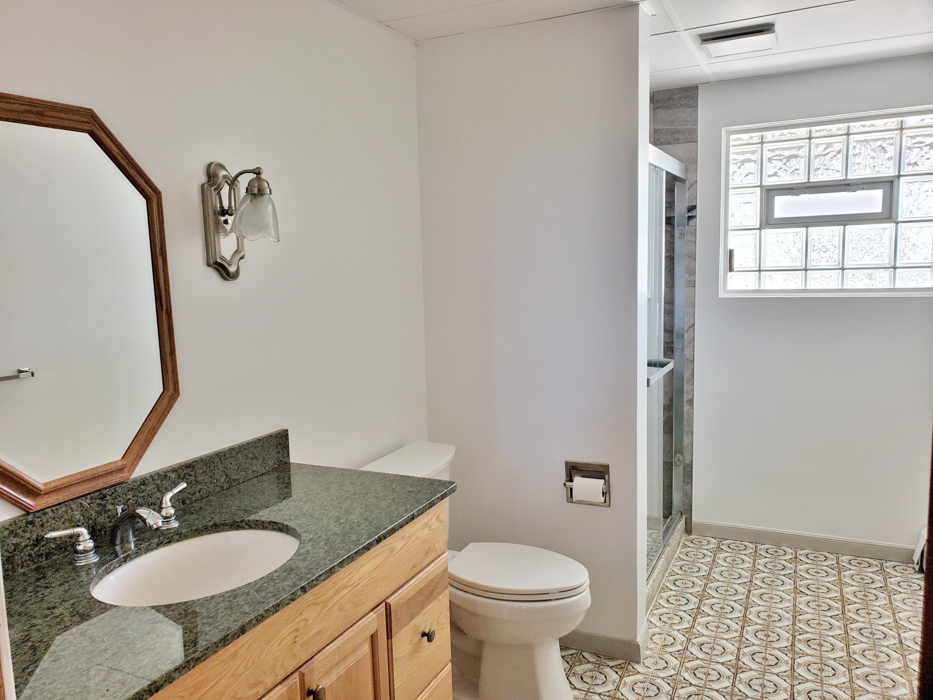 1441 North Wozniak Road La Porte, IN 46350 - Photo 39 of 46 a bathroom with a granite countertop sink toilet and mirror