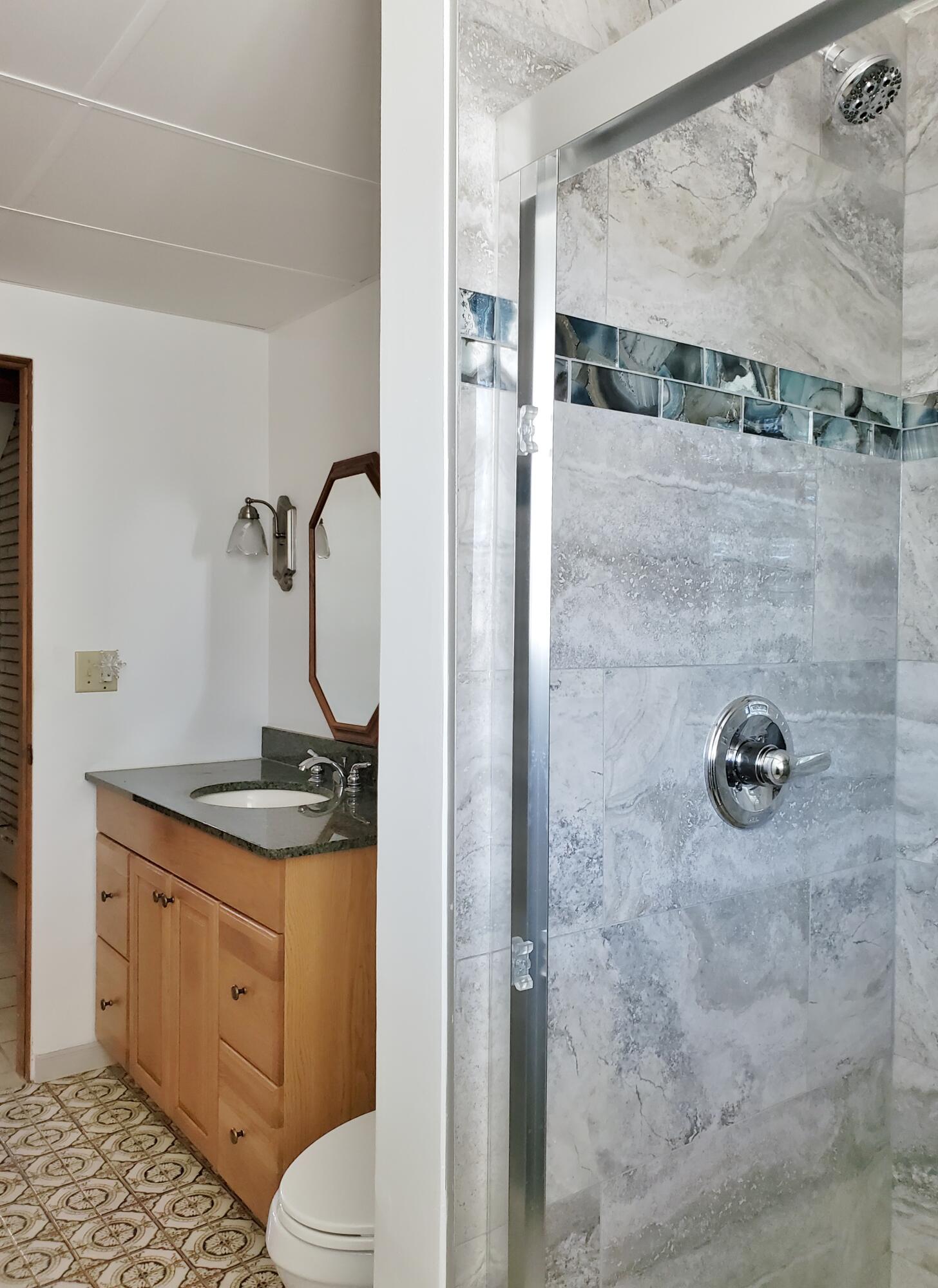 1441 North Wozniak Road La Porte, IN 46350 - Photo 40 of 46 a bathroom with a granite countertop shower a toilet and a sink