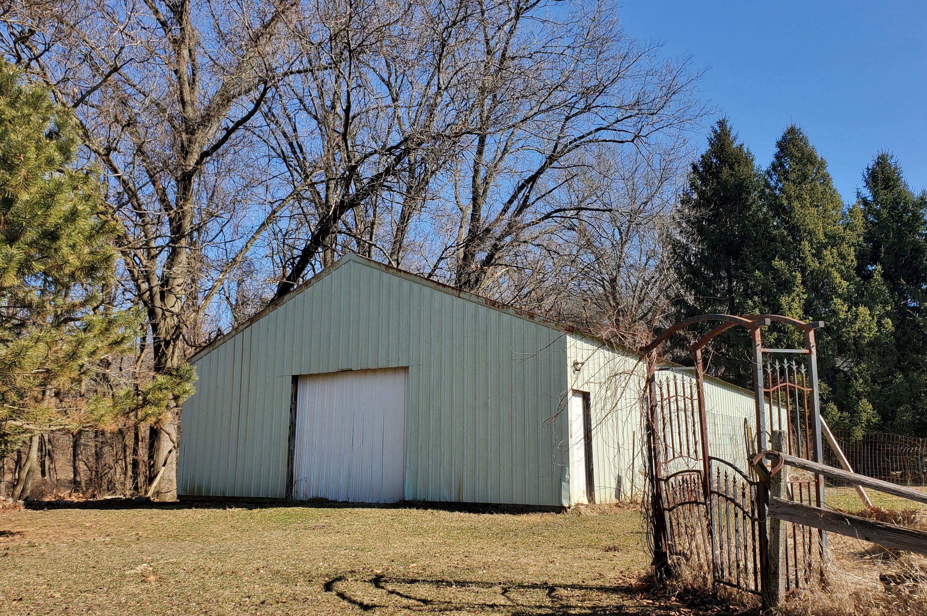1441 North Wozniak Road La Porte, IN 46350 - Photo 45 of 46 a house with trees in front of it