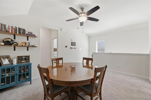 a view of a dining room with furniture
