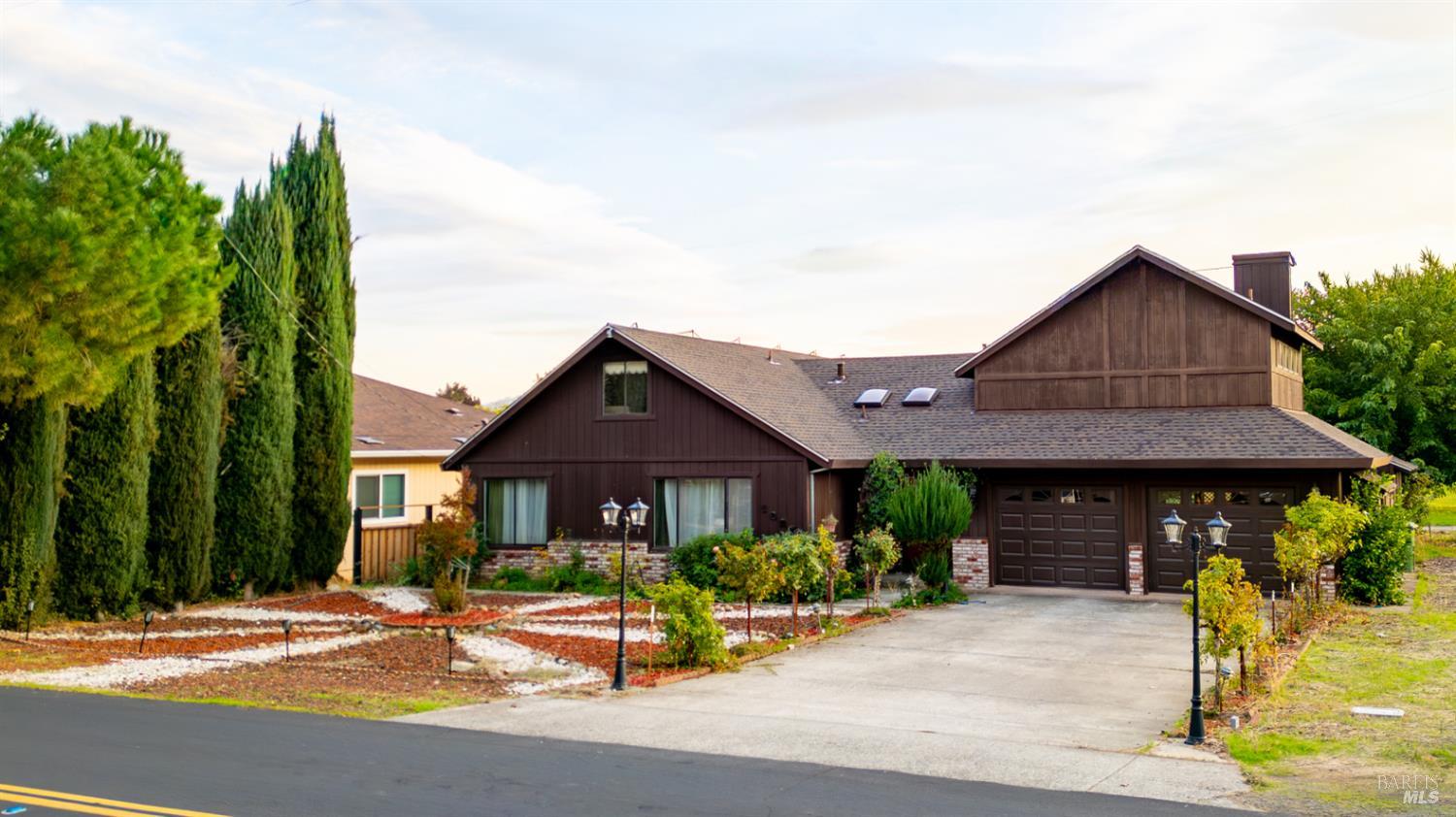 a front view of a house with garden