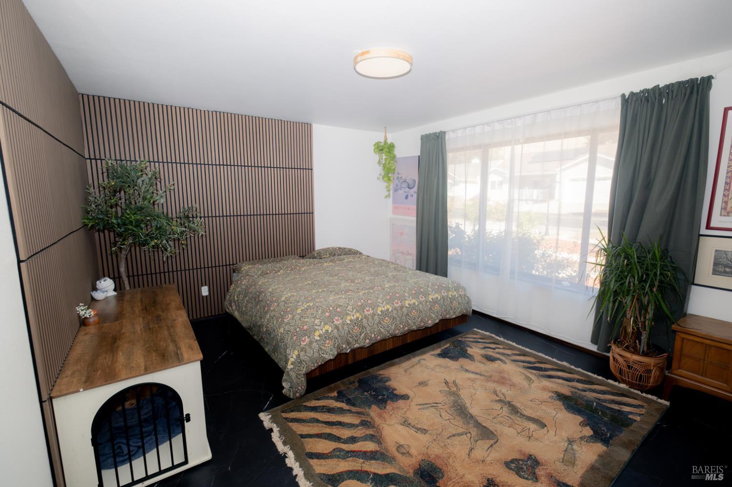 18279 Hidden Valley Road Hidden Valley Lake, CA 95467 - Photo 23 of 49 a bedroom with a bed and a potted plant