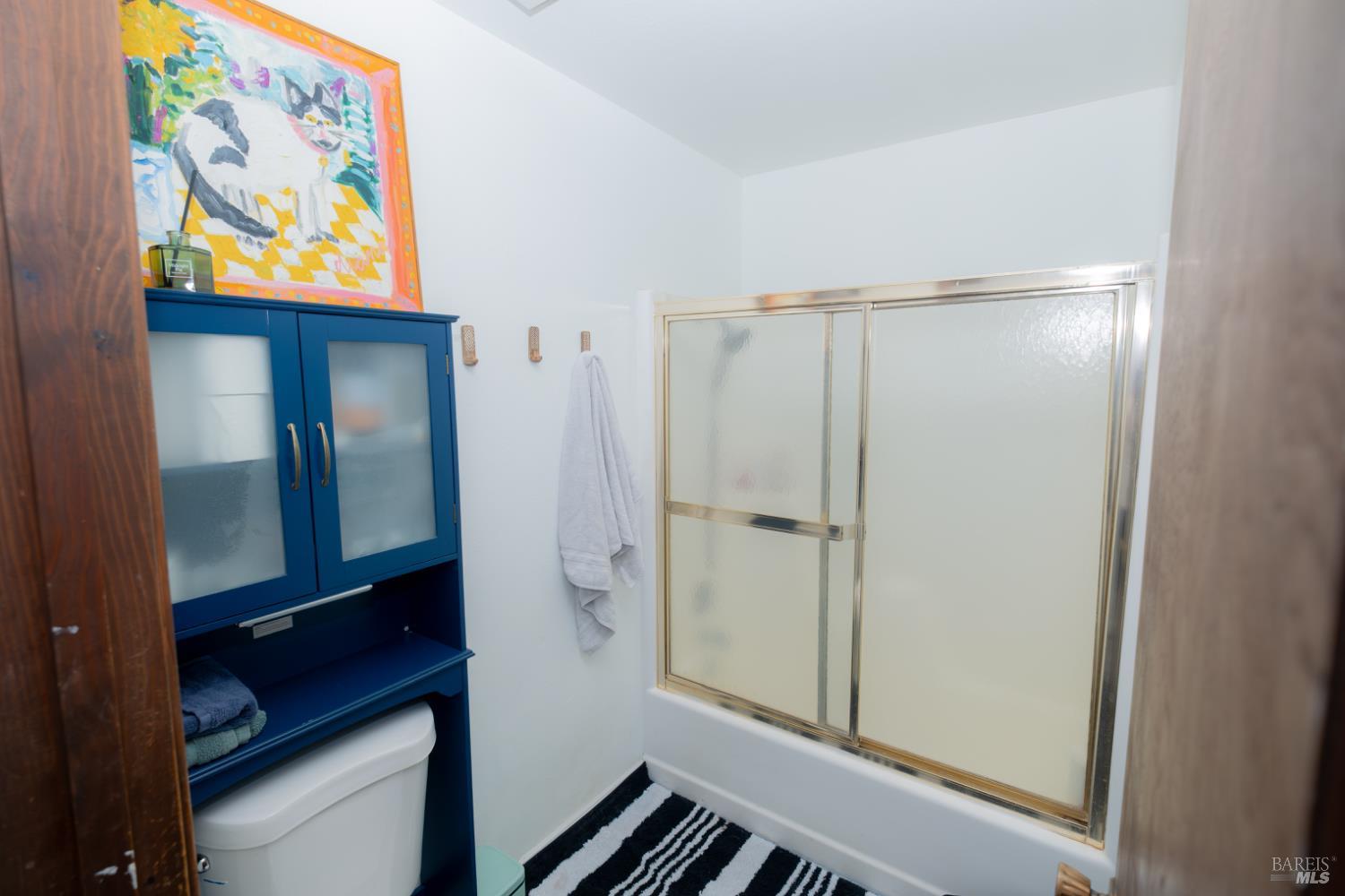 18279 Hidden Valley Road Hidden Valley Lake, CA 95467 - Photo 28 of 49 a bathroom with a glass door shower and a sink