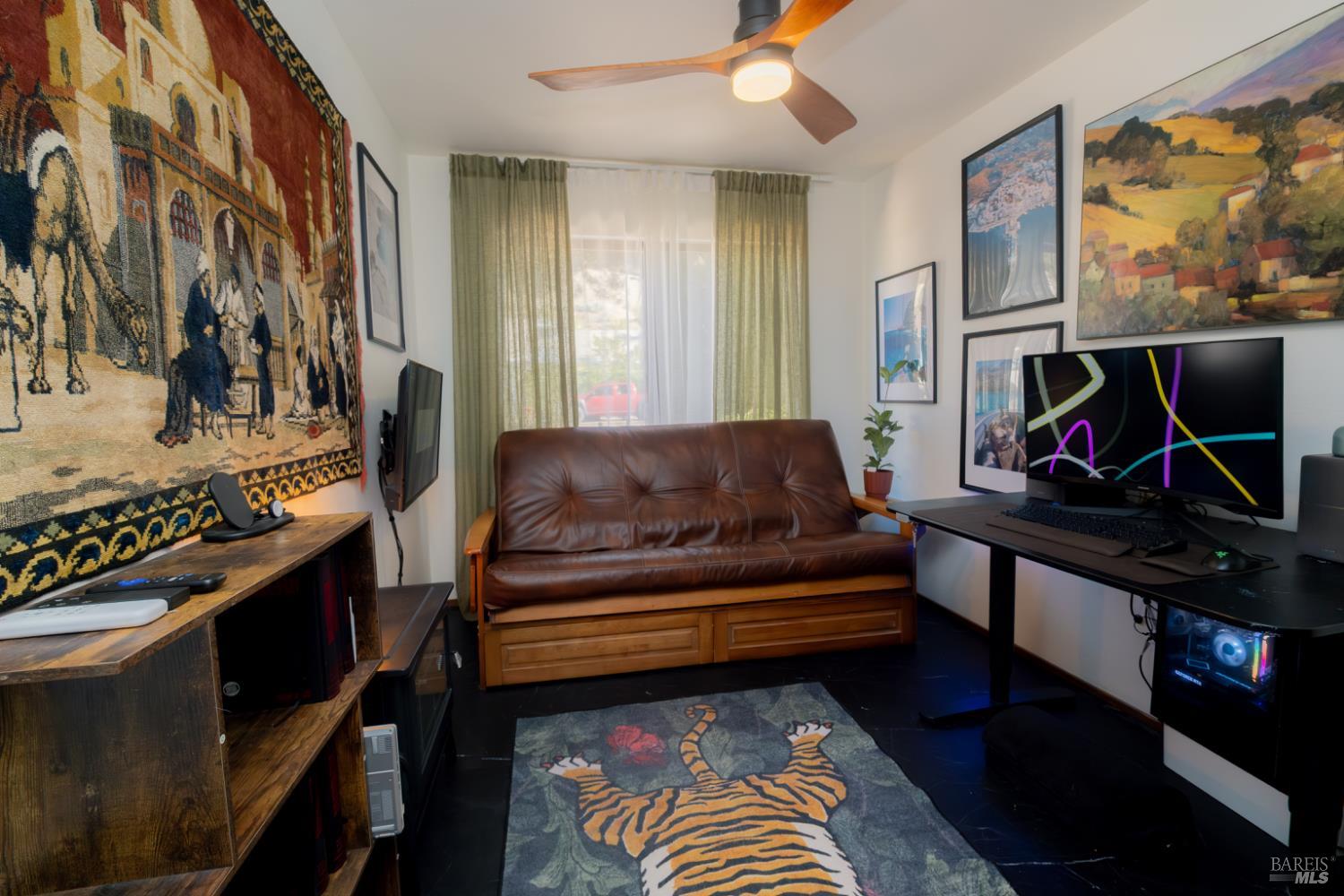 18279 Hidden Valley Road Hidden Valley Lake, CA 95467 - Photo 30 of 49 a living room with furniture a flat screen tv and a fireplace