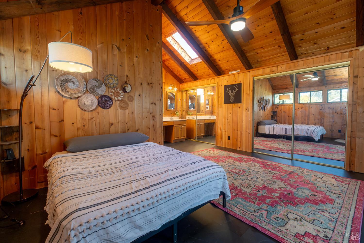 18279 Hidden Valley Road Hidden Valley Lake, CA 95467 - Photo 39 of 49 a bedroom with a bed and wooden floor