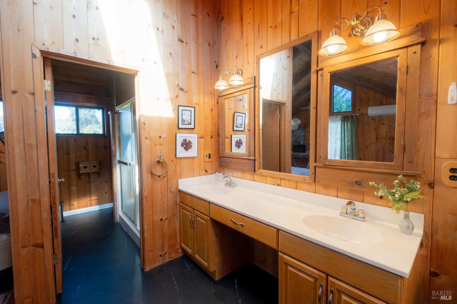 18279 Hidden Valley Road Hidden Valley Lake, CA 95467 - Photo 41 of 49 a bathroom with a sink and a mirror