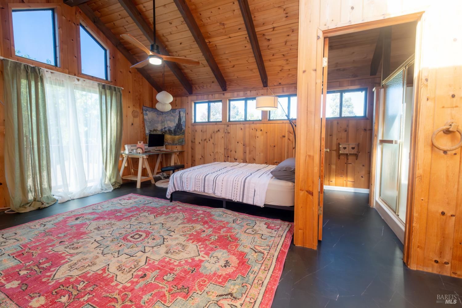 18279 Hidden Valley Road Hidden Valley Lake, CA 95467 - Photo 42 of 49 a bedroom with a bed and a large window with outer view