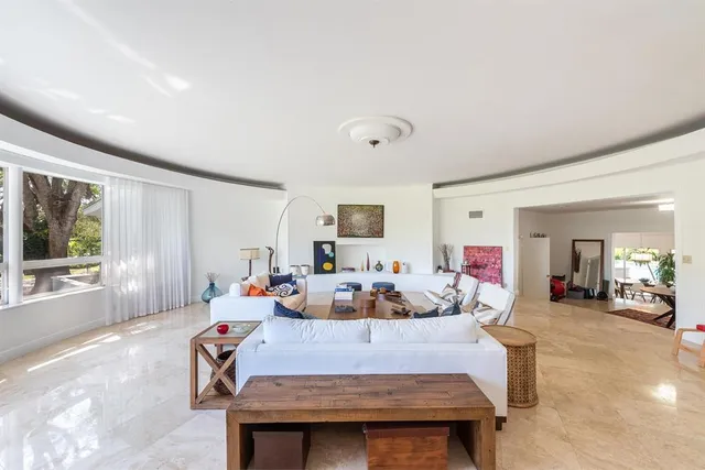 a bedroom with furniture and a window