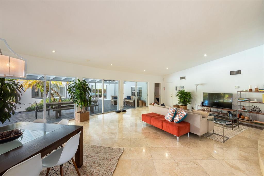 6205 Southwest 108th Street Pinecrest, FL 33156 - Photo 14 of 28 a living room with furniture and a flat screen tv
