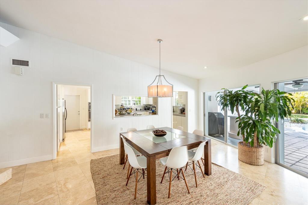 6205 Southwest 108th Street Pinecrest, FL 33156 - Photo 15 of 28 a dining room with furniture and a potted plant