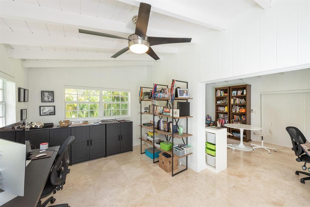 6205 Southwest 108th Street Pinecrest, FL 33156 - Photo 24 of 28 a view of a workspace with furniture and a window