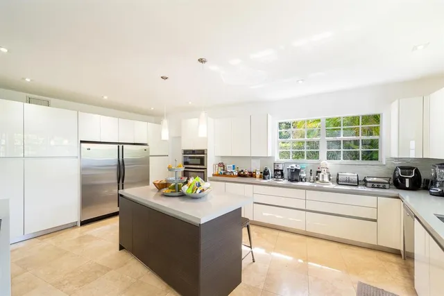 a bathroom with a bathtub sink and mirror