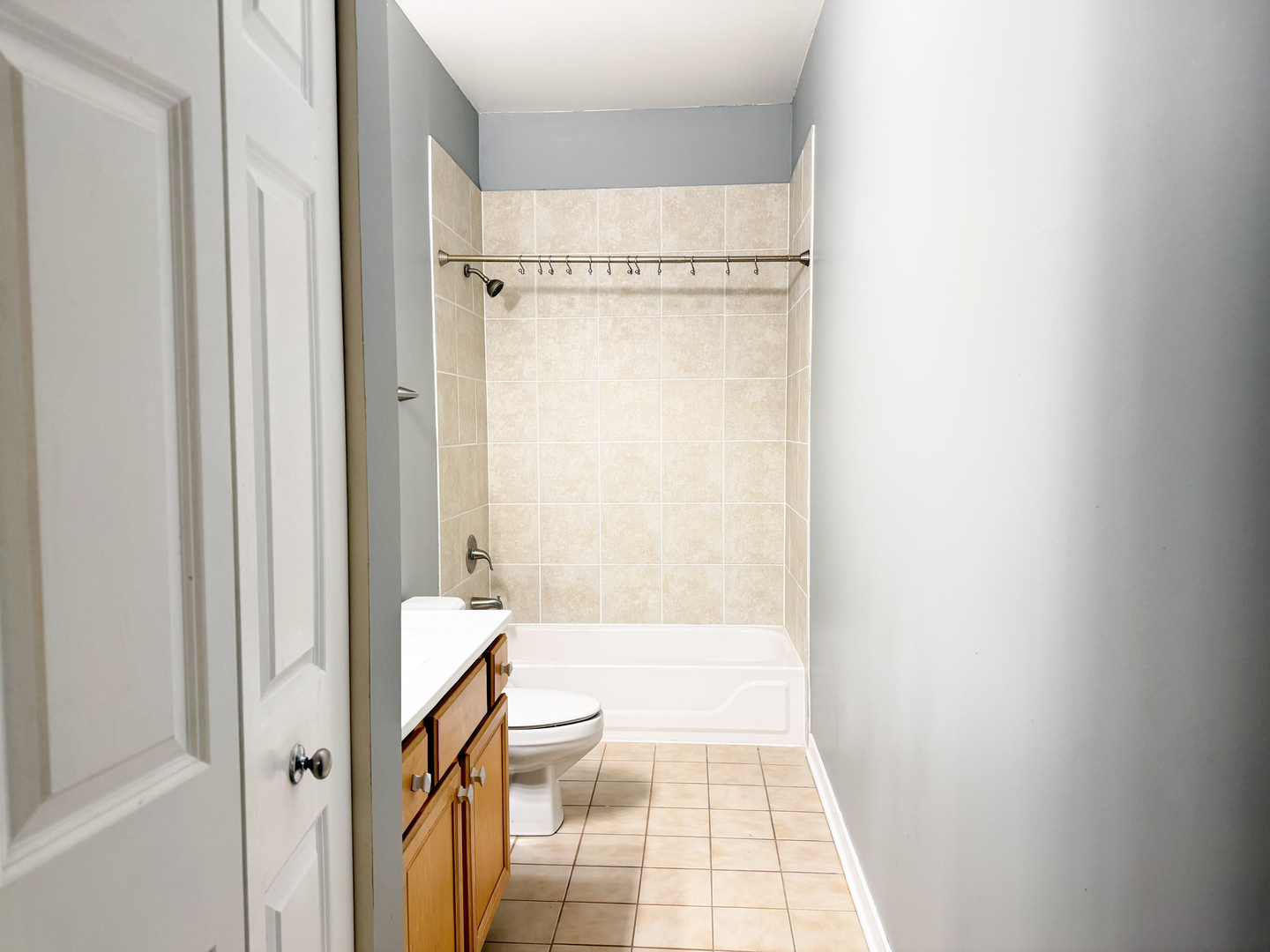 1300 West Grenshaw Street, Unit B Chicago, IL 60607 - Photo 8 of 14 a bathroom with a granite countertop window a toilet and a shower