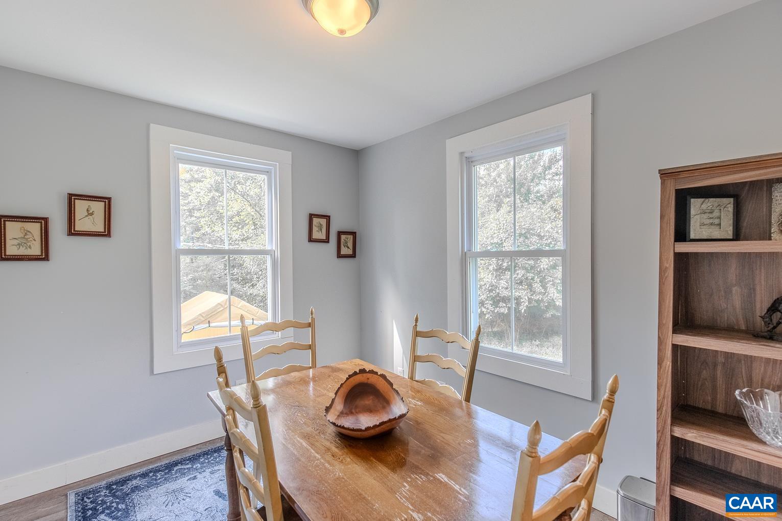 5165 Three Notch'd Road Crozet, VA 22932 - Photo 4 of 25 a view of a dining room with furniture window and wooden floor