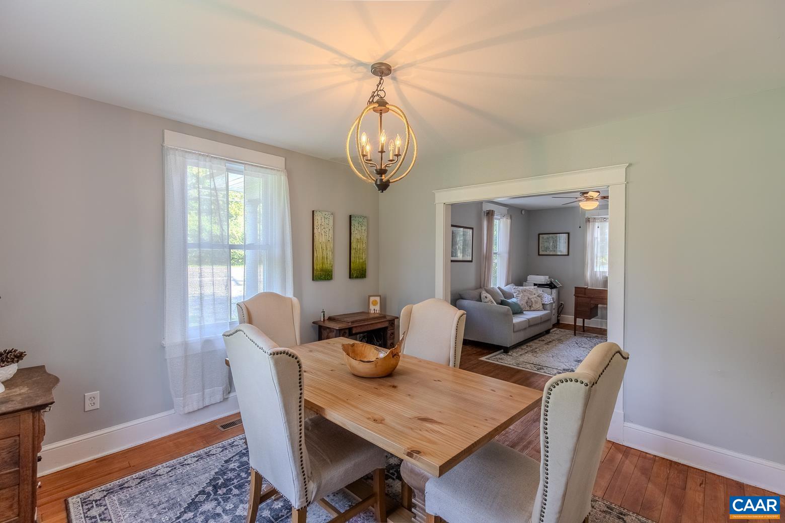 5165 Three Notch'd Road Crozet, VA 22932 - Photo 7 of 25 a view of a dining room with furniture window and wooden floor