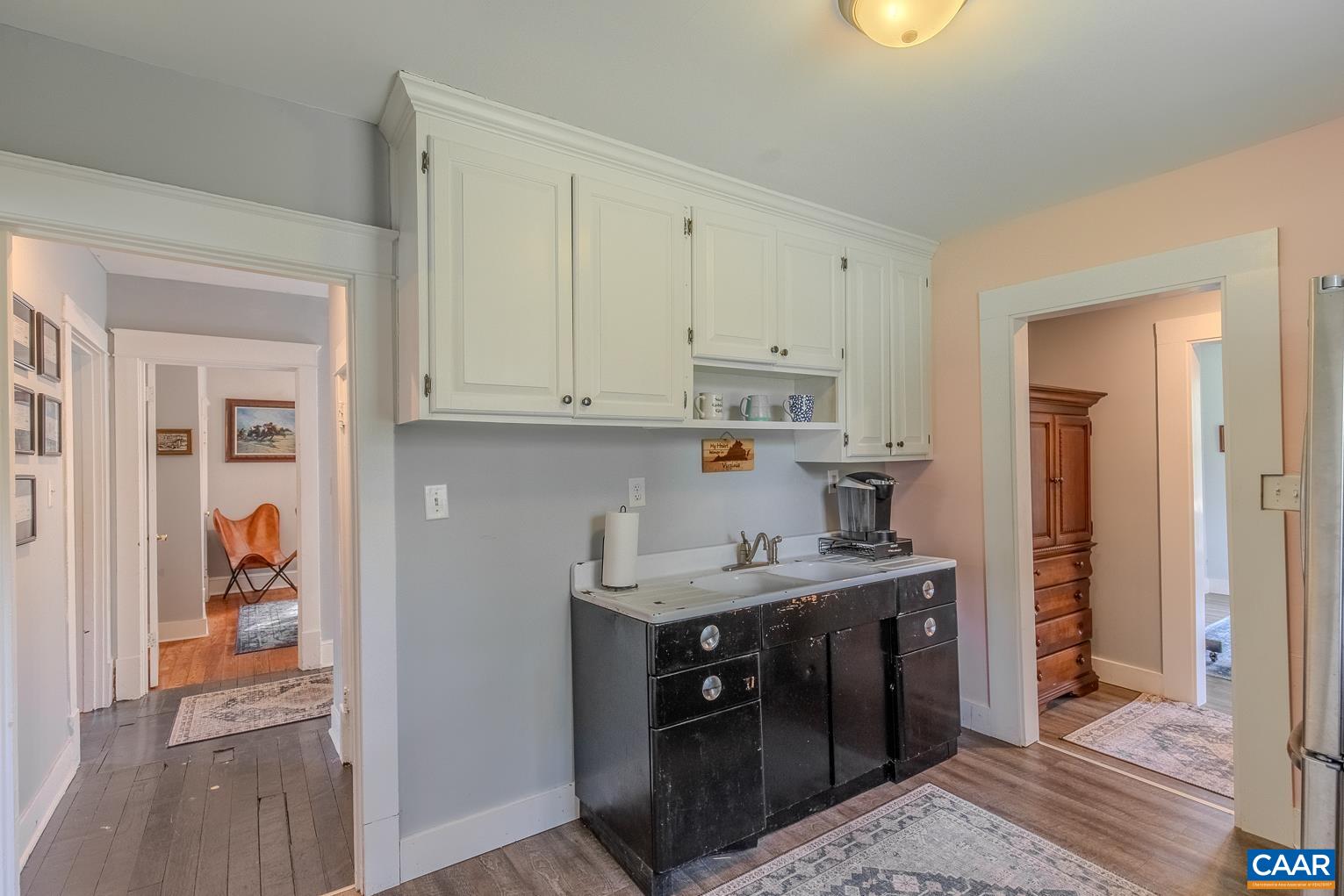 5165 Three Notch'd Road Crozet, VA 22932 - Photo 8 of 25 a kitchen with a sink stove and cabinets