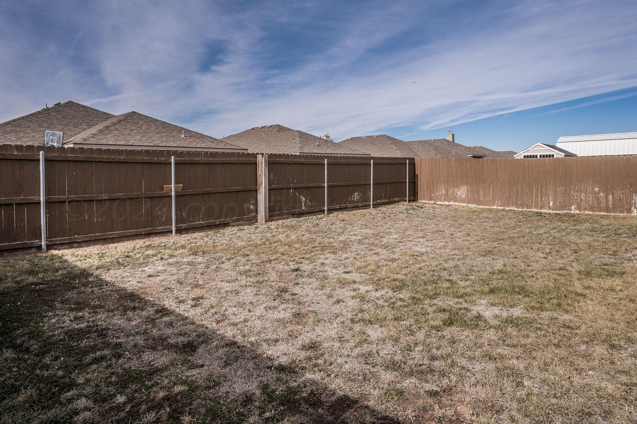 4806 Eberly Street Amarillo, TX 79118 - Photo 18 of 19 a view of a house with a yard and garage