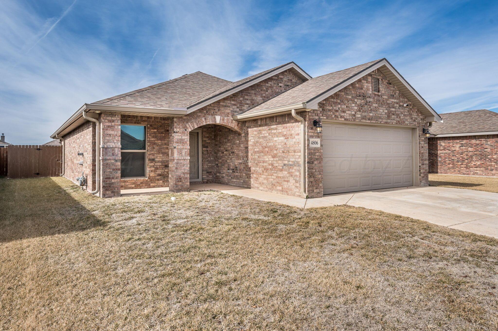 4806 Eberly Street Amarillo, TX 79118 - Photo 2 of 19 front view of a house with a yard