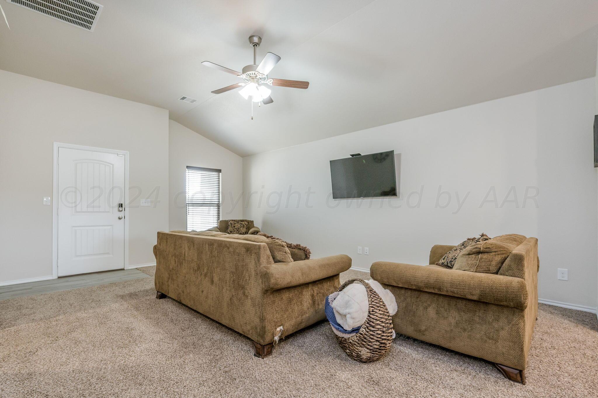 4806 Eberly Street Amarillo, TX 79118 - Photo 5 of 19 a living room with furniture and a flat screen tv